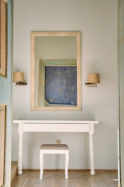 istock Elegant Interior Design Featuring a Stylish Console Table, Cozy Stools, and a Beautiful Wall Mirror Enhancing the Modern Living Space Ambiance 2248767947