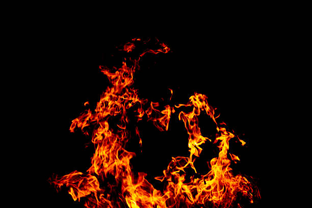 istock Bright fiery symbol on a black background. Fire background. Fire flame on a black background. 2248769328