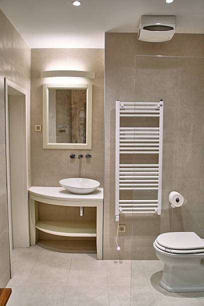 Friendly bathroom for children with orange tiles and flower decors,