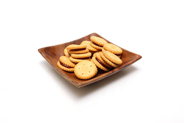 istock Crackers stuffed with strawberry jam isolated on a white background. 2248770051