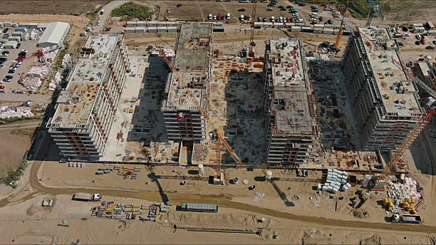 istock Industrial construction site with houses equipment and materials 2248770101
