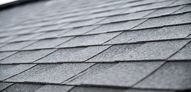 istock Dark gray asphalt roof shingles texture background 2248770200