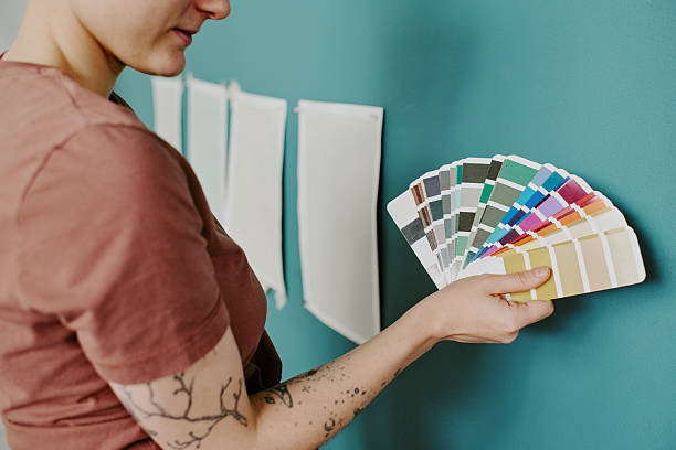 istock Woman Choosing Paint Colors While Renovating New Apartment 2248771385