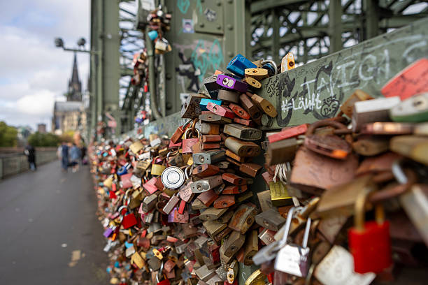 Cologne, Germany, September 26, 2025: Many locks hang on the Hohenzollern bridge - Cologne's love lock bridge