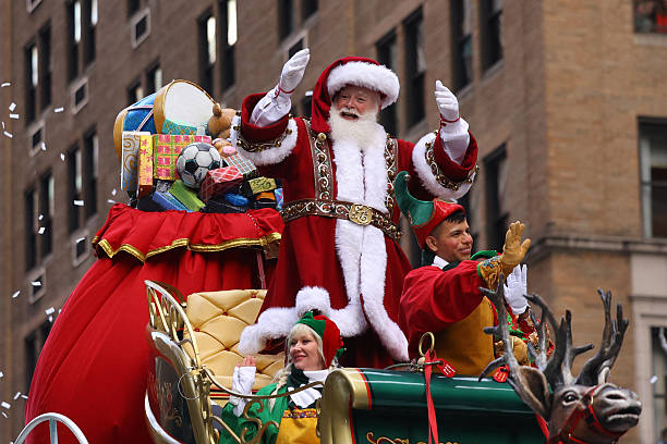 Santa Claus waves to the crowds from on top of the Macy's Santa's Sleigh float during the The 99th Macy's Thanksgiving Day Parade in New York, Thursday, Nov. 27, 2025.