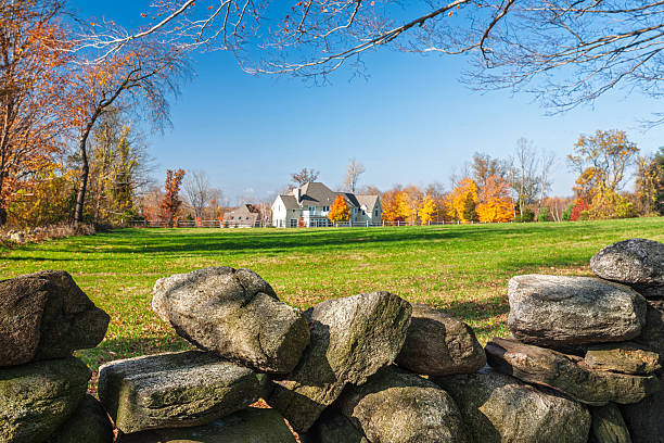 old Stone farm building with green meadows