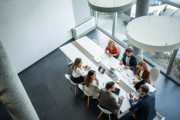 istock Business colleagues collaborating on meeting table in modern office 2248787458