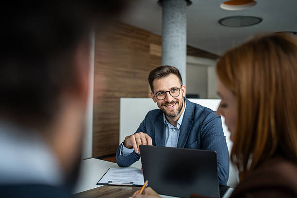 istock Financial advisor consulting clients in office meeting 2248787502