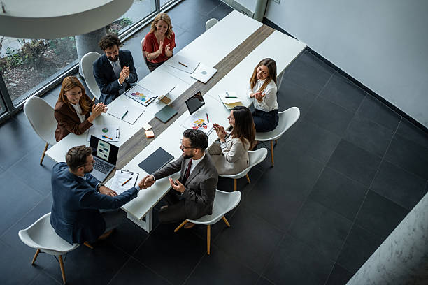 istock Business people shaking hands celebrating successful agreement 2248787554