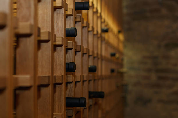 Variation wine bottle on the wooden rack for sale