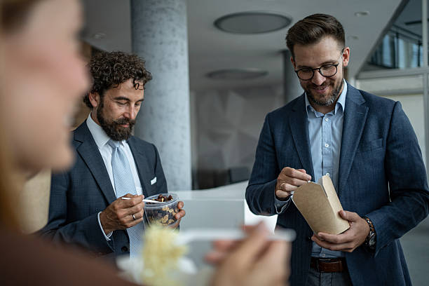 istock Business colleagues enjoying lunch break in modern office 2248789297