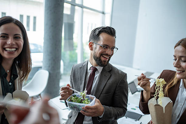istock Business colleagues enjoying lunch break and sharing conversation 2248789359