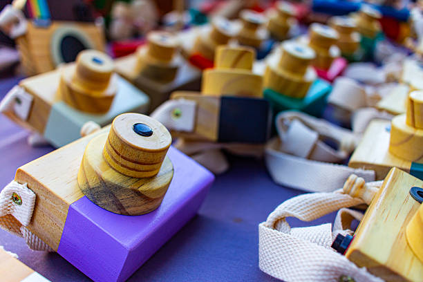 Colorful toy cameras. Handcrafted item for sale on the street