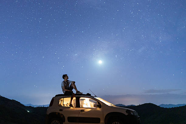 istock Contemplating the stars on a road trip night 2248789799