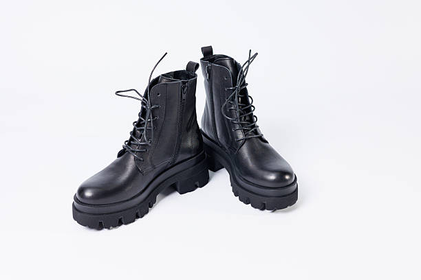istock Women's black leather boots on a white background. Shoes and options for its layout. Autumn shoes. Boots. Autumn boots. Shoes close up 2248790422