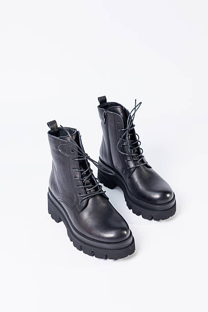 istock Women's black leather boots on a white background. Shoes and options for its layout. Autumn shoes. Boots. Autumn boots. Shoes close up 2248790466