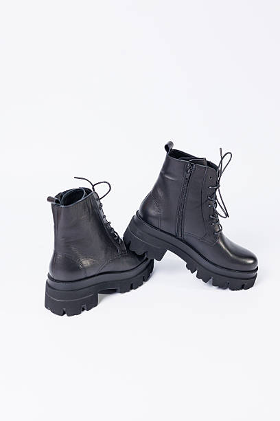 istock Women's black leather boots on a white background. Shoes and options for its layout. Autumn shoes. Boots. Autumn boots. Shoes close up 2248790591