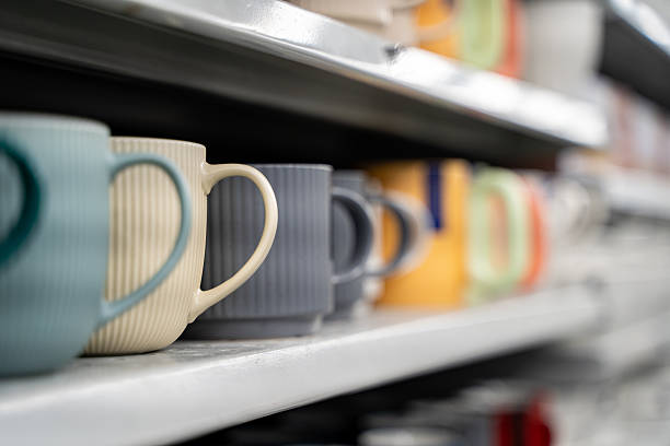 istock Close up of ceramic mugs arranged on store shelf 2248790668