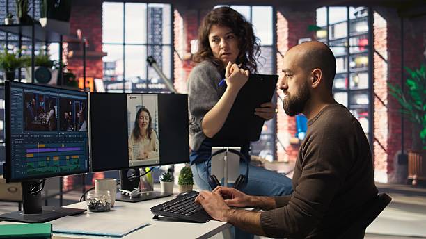 istock Team edits smartphone video footage on a dual monitors setup 2248791611