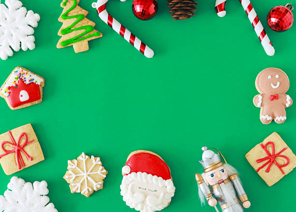istock Festive Christmas cookies, ornaments, and decorations arranged on a green background with ample copy space for holiday messages, ads, or seasonal designs. 2248791950