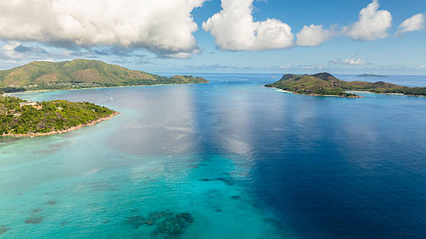 istock A calm bay with two lush islands and vibrant waters. Praslin, Seychelles. 2248792292