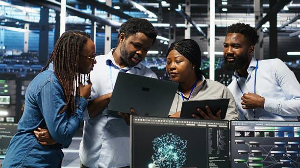 istock Portrait of smiling data center specialists collaborating in server facility 2248793067