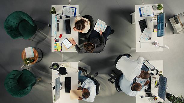 istock Top down view of corporate employees study business reports 2248793712