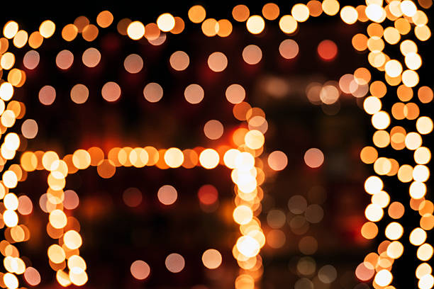 istock Warm abstract bokeh lights in soft orange tones on black background 2248795018