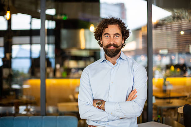 istock Confident businessman looking at camera with arms crossed 2248795024