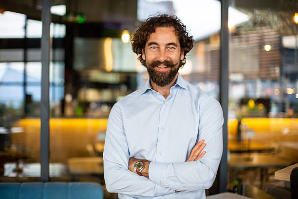 istock Confident businessman with beard smiling at camera 2248795103