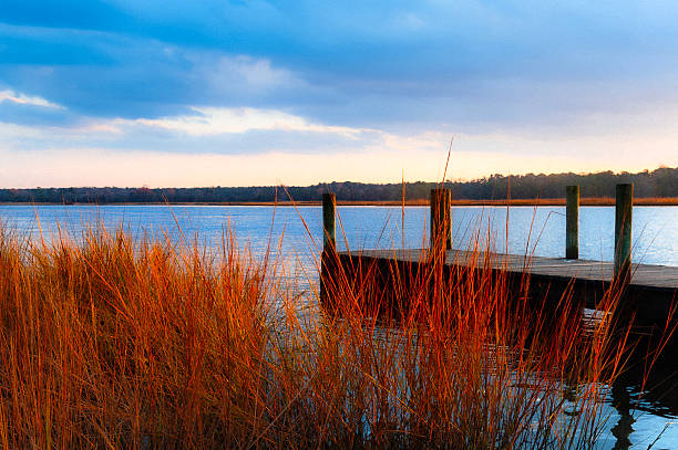 istock Wooden Dock at Sunset on Calm Lake 2248795913