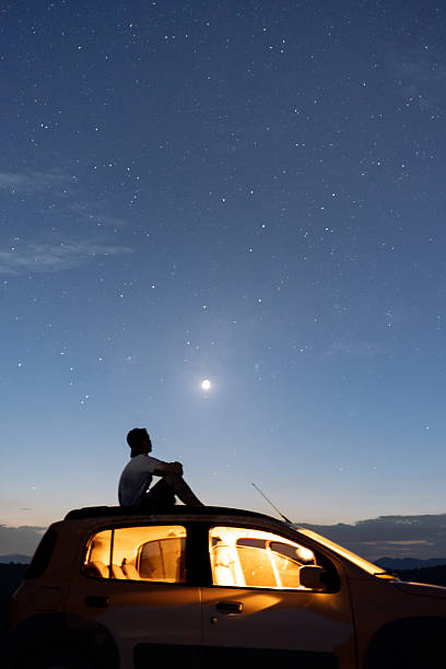 istock Contemplating the stars on a road trip night 2248798259