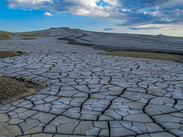 istock Mud volcano in Romania with cracked barren surface dry clay patterns geological landscape natural texture 2248798510