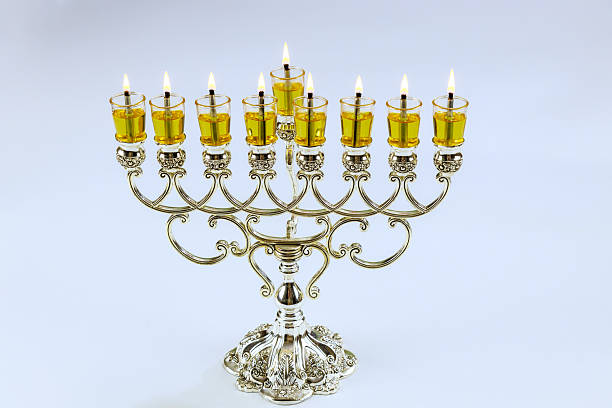 istock Decorative menorah with lit candles displaying flames during Hanukkah celebration 2248798900