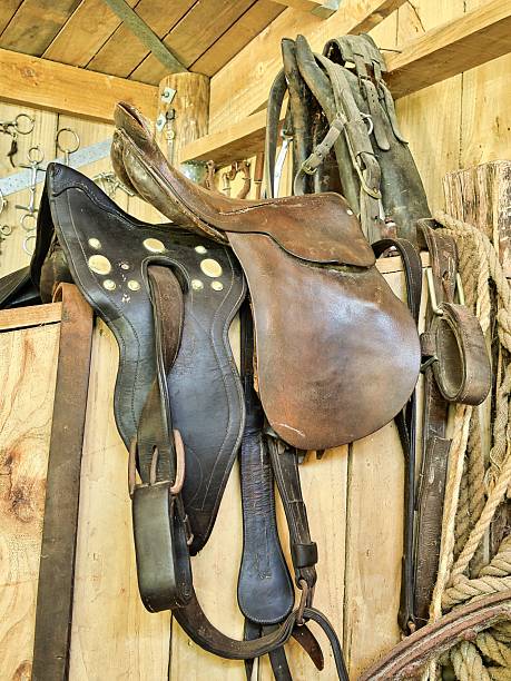 Two Horse saddles made out of leather.