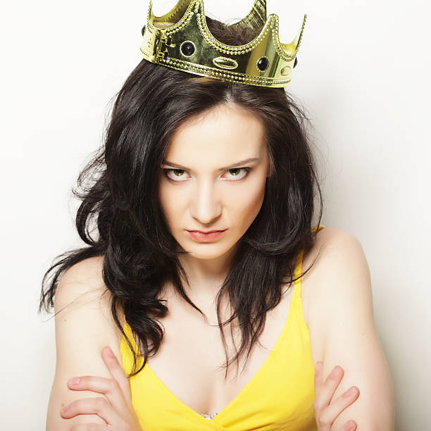istock pretty brunette woman wearing crown 2248800276