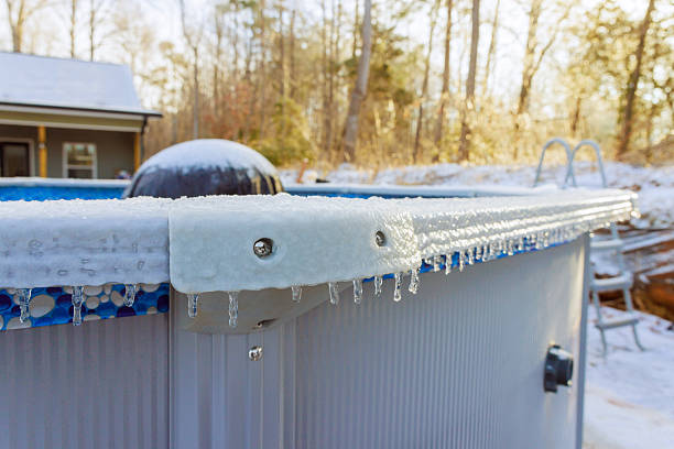 istock Frozen icicles form along edge of pool in winter landscape 2248800346