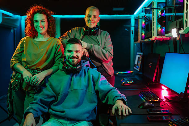 istock Gamers friends posing in gaming room with neon lights 2248800906