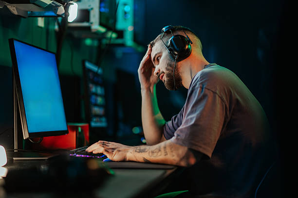 istock Frustrated young man losing during intense online gaming 2248801041