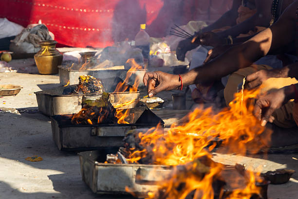 istock sacred hindu havan ritual with priests holy offering into fire pits 2248804563