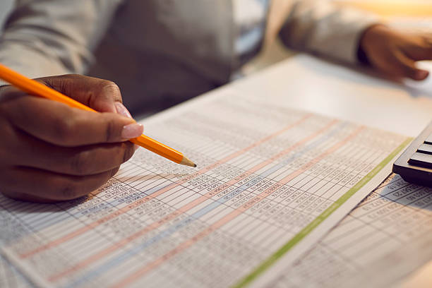 istock Financial accountant sitting in office, doing paperwork and working with spreadsheets 2248805239
