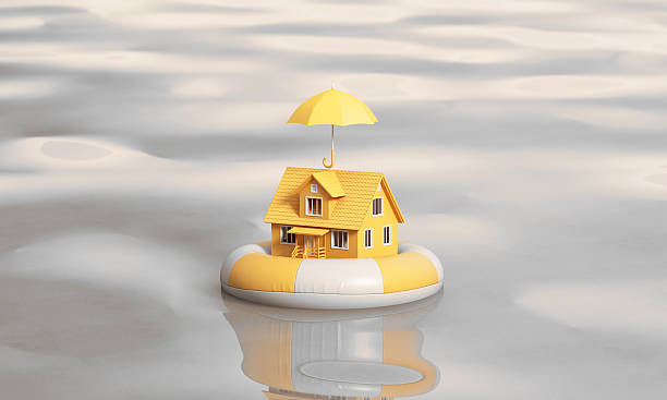 istock A yellow house rests safely on a floating ring with an umbrella above, representing strong flood insurance and home protection. 3d render 2248807074