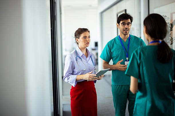 istock Doctors and nurses are having a discussion about a patient in a hospital corridor 2248808225