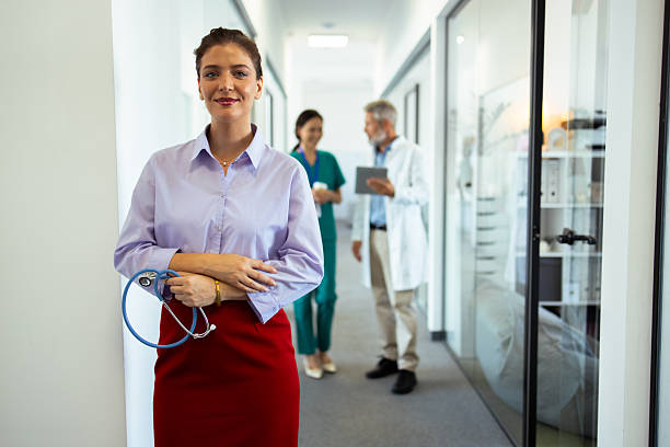 istock Confident doctor posing in hospital corridor with stethoscope 2248808228