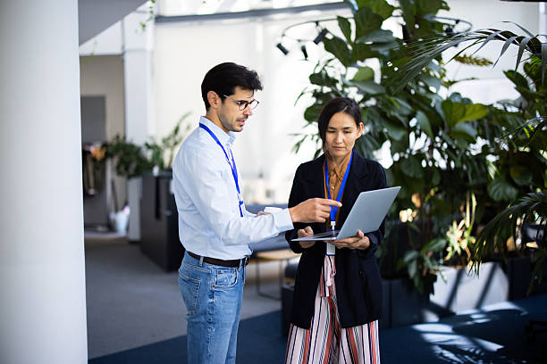 istock Business colleagues discussing work on laptop in modern office 2248808344