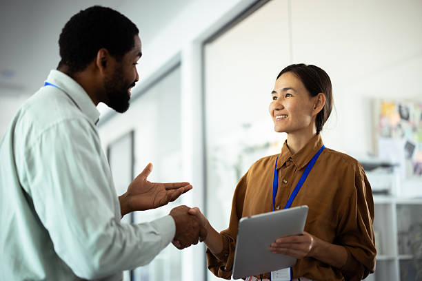 istock Business people shaking hands in modern office 2248808391