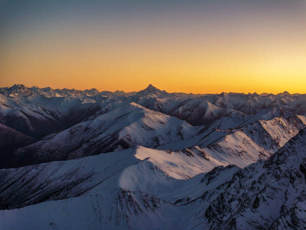 istock Golden twilight over snow-capped mountains at dusk 2248810238