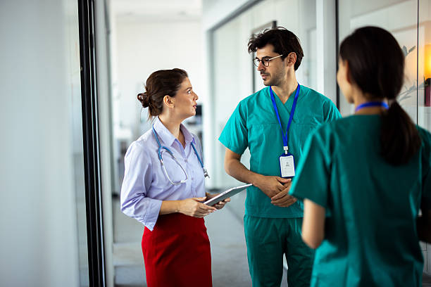 istock Medical team discussing patient status during hospital round 2248811530