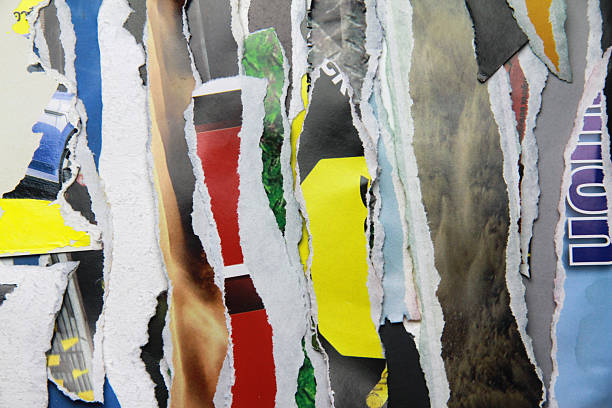 istock Multicolored poster paper, torn into numerous pieces. 2248811645
