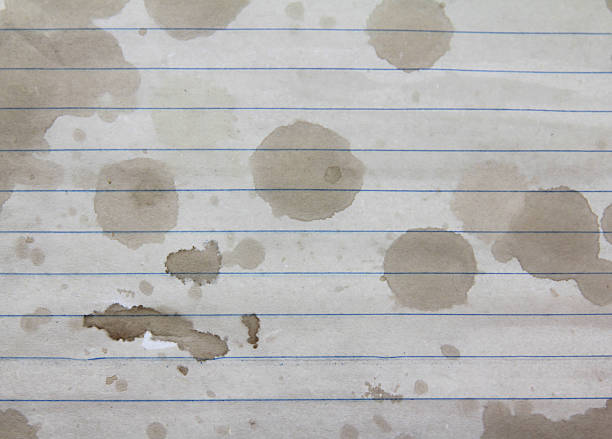 Old yellow aged paper vintage and texture background. Abstract grunge brown beige grunge pattern. The surface and edges material are torn and weathered with coffee and tea and water stains. Dirty paper texture. Blank sheet copy space abstract pattern effect surface level suit for wall paper screen saver, design. Dark, dirty, dust and scratches texture.